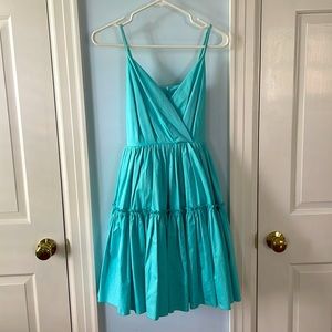 Lili Sidonio boutique turquoise mini dress with tie bow back and tiered skirt